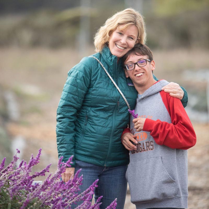 Big Wave resident with special needs and his mother