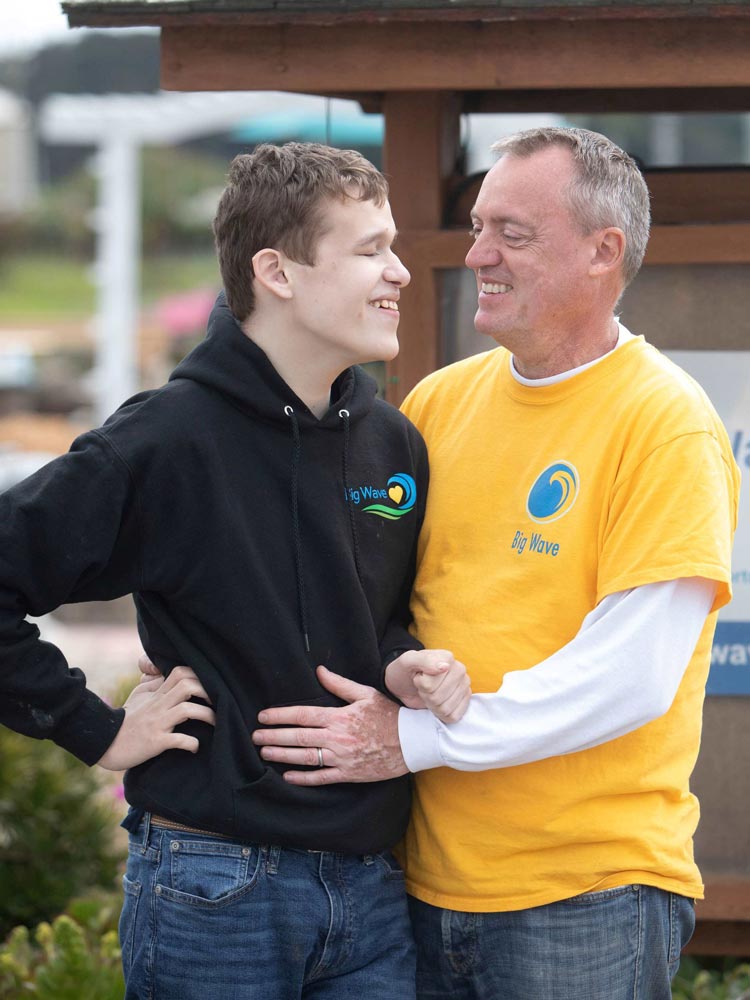 Big Wave resident with special needs with his father