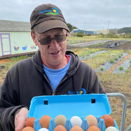 resident preparing farm eggs for sale