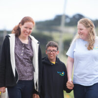 Big Wave future residents Liz, Sam and Sara at Big Wave Farm