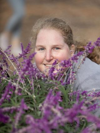 Big Wave resident with disabilities happily working in garden